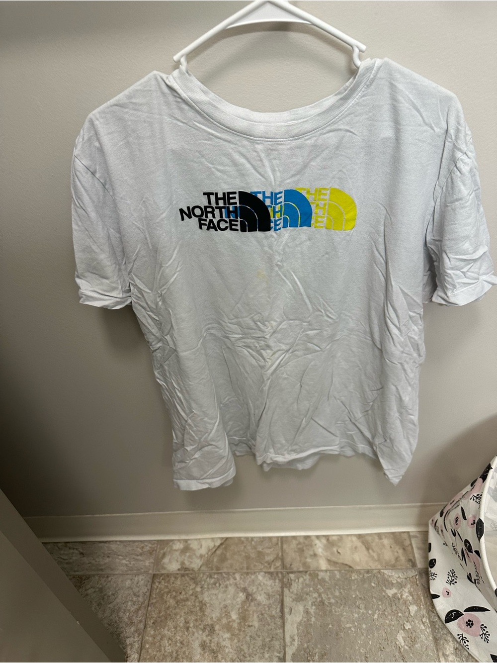 The North Face White Tee with Black, Blue & Yellow Logo - Women